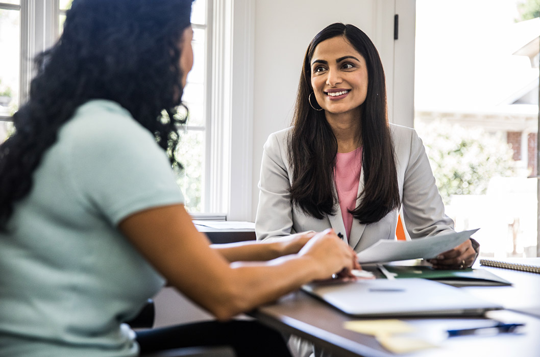 Two women sitting in an office